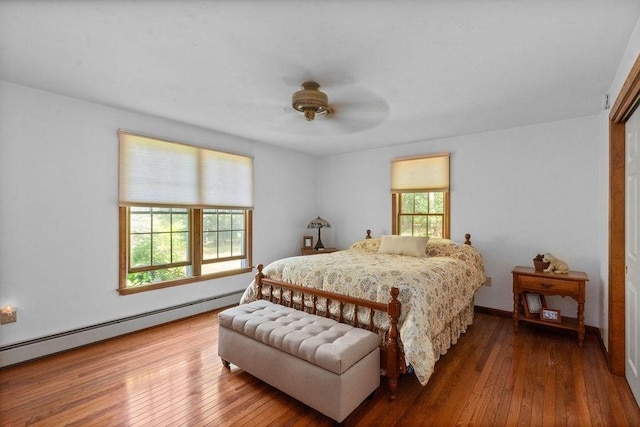 344 Mayfair Rd, Dennis, MA 02660 - bedroom with hardwood / wood-style flooring, baseboard heating, and a ceiling fan