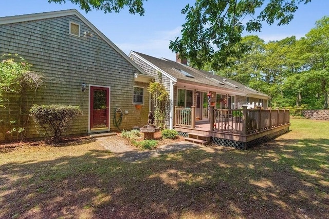 344 Mayfair Rd, Dennis, MA 02660 - back of property with a wooden deck, a lawn, and a chimney