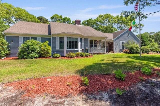 344 Mayfair Rd, Dennis, MA 02660 - single story home with a front yard and a chimney
