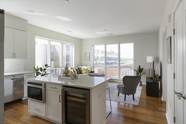 3531 Washington St Unit 501, Boston, MA 02130 - kitchen with beverage cooler, appliances with stainless steel finishes, healthy amount of natural light, and light countertops
