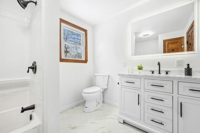 bathroom with marble finish floor, toilet, vanity, and baseboards