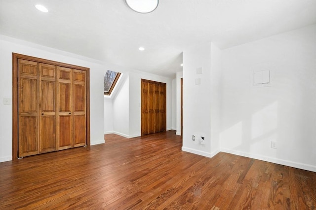 interior space with dark wood-style floors, recessed lighting, and baseboards