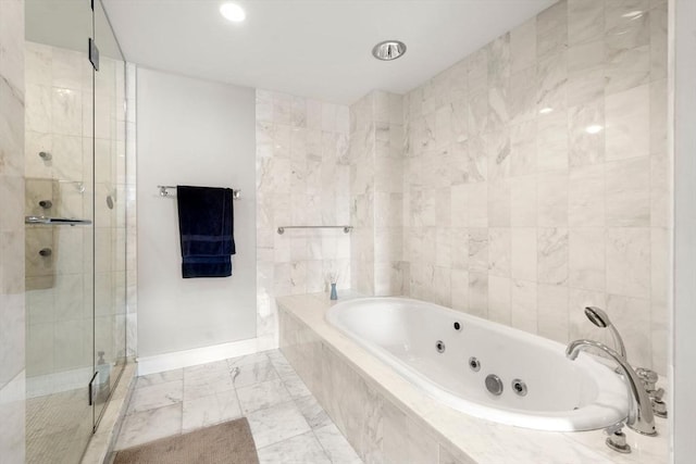 bathroom with tile walls, a whirlpool tub, a shower stall, and marble finish floor