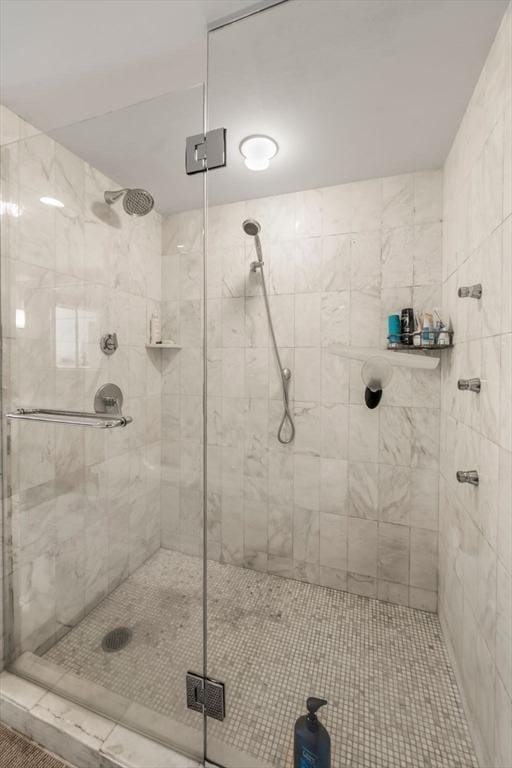 full bath with a shower stall
