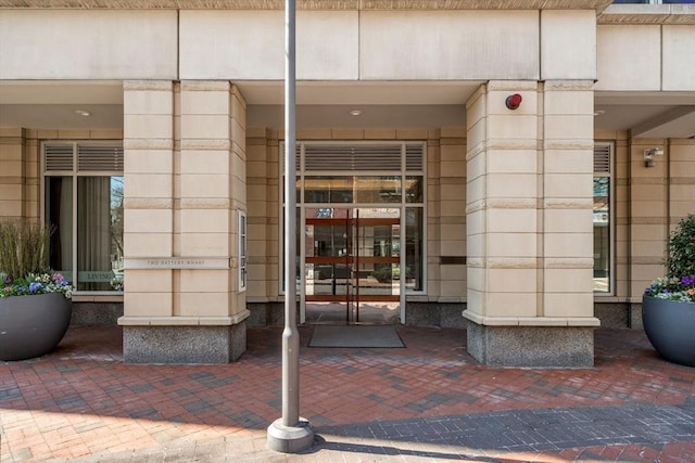 view of exterior entry featuring french doors