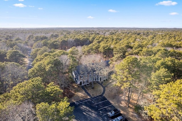 birds eye view of property featuring a wooded view