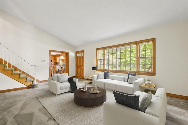 9 Divittorio Dr, Milford, MA 01757 - carpeted living room featuring baseboards, stairs, and vaulted ceiling