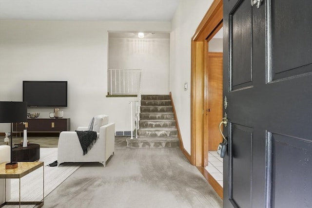 9 Divittorio Dr, Milford, MA 01757 - entrance foyer featuring stairs, light carpet, and baseboards