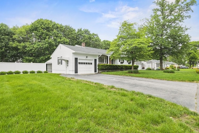 9 Divittorio Dr, Milford, MA 01757 - view of front facade with a chimney, an attached garage, and driveway