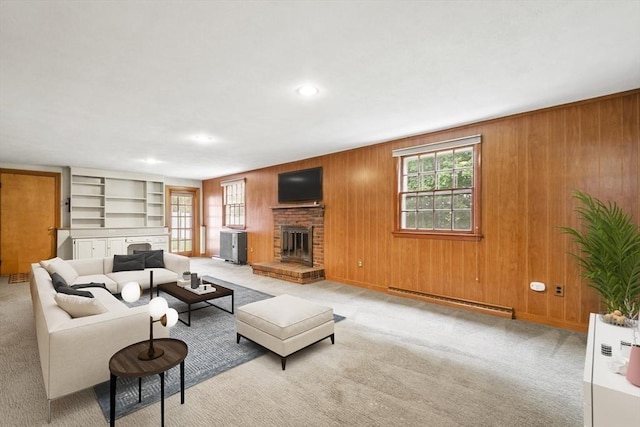 9 Divittorio Dr, Milford, MA 01757 - carpeted living area with baseboard heating, a brick fireplace, wood walls, recessed lighting, and built in features