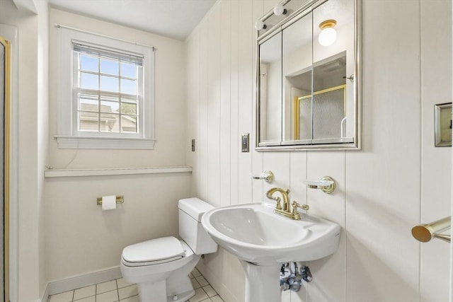 9 Divittorio Dr, Milford, MA 01757 - bathroom featuring toilet, a shower with shower door, tile patterned flooring, baseboards, and a sink