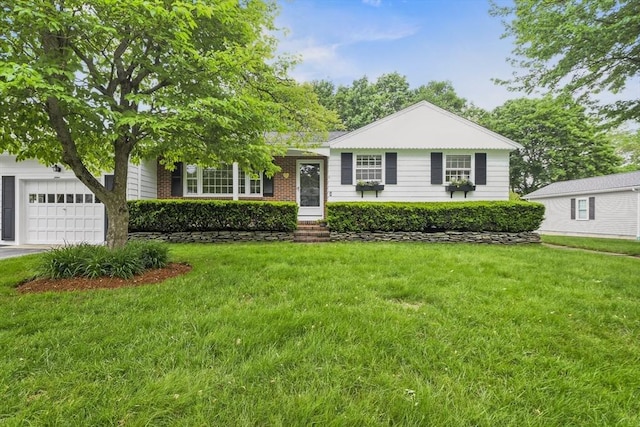 9 Divittorio Dr, Milford, MA 01757 - view of front of home featuring a garage and a front lawn