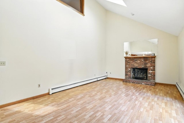 unfurnished living room with a fireplace, high vaulted ceiling, wood finished floors, a skylight, and a baseboard heating unit