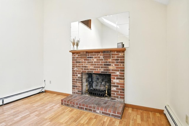unfurnished living room featuring baseboards, a baseboard radiator, a brick fireplace, and wood finished floors