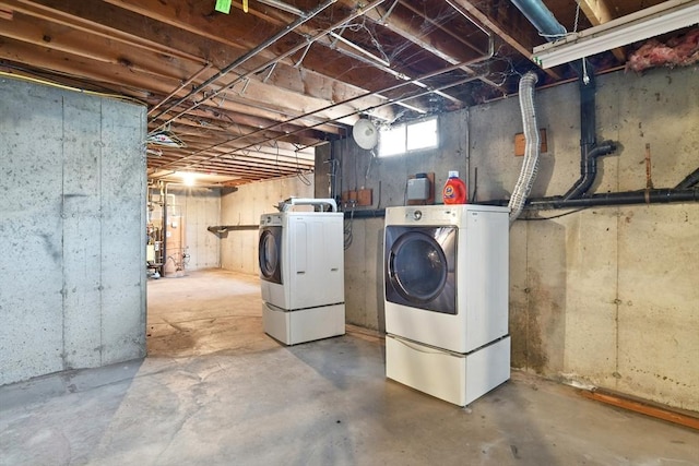 basement featuring washing machine and clothes dryer