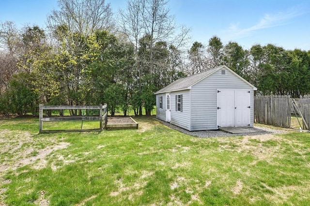 view of shed with fence