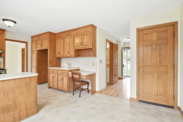 kitchen with light countertops and baseboards