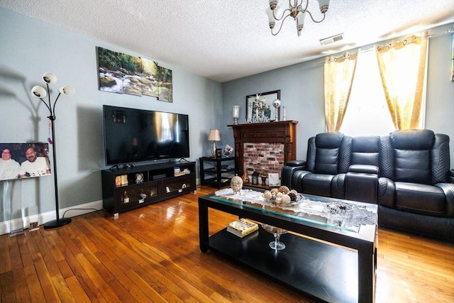 living room featuring hardwood / wood-style floors and a textured ceiling