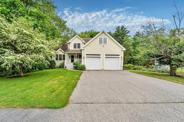 8 Frances Dr, Newburyport, MA 01950 - traditional-style house with asphalt driveway and a front lawn