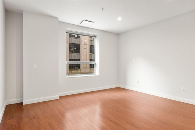 empty room featuring hardwood / wood-style flooring