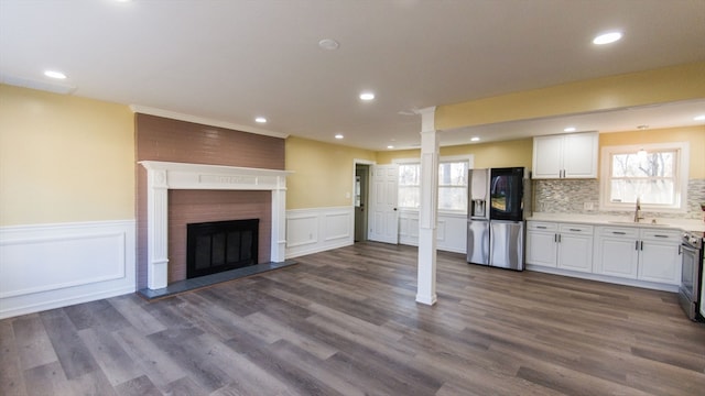 kitchen featuring white cabinets, dark hardwood / wood-style floors, and appliances with stainless steel finishes