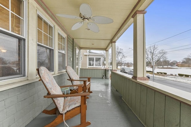 balcony featuring covered porch and ceiling fan