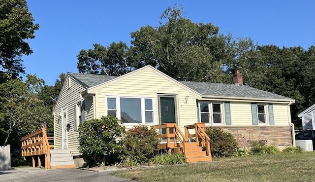 view of front of property with a wooden deck