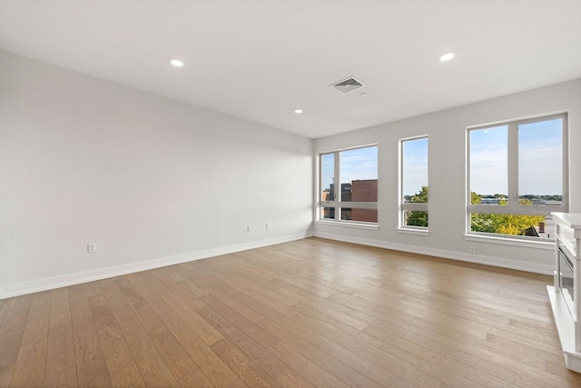 spare room featuring light hardwood / wood-style floors