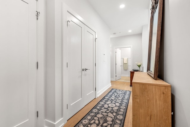 hallway with light wood-type flooring