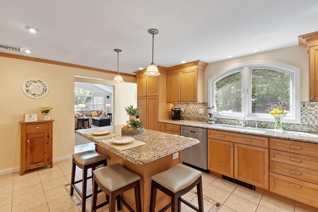 2 Pomfret Rd, Chelmsford, MA 01824 - kitchen with stainless steel dishwasher, a sink, a breakfast bar area, tasteful backsplash, and recessed lighting