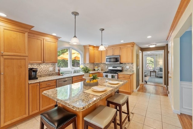 2 Pomfret Rd, Chelmsford, MA 01824 - kitchen featuring appliances with stainless steel finishes, plenty of natural light, backsplash, a breakfast bar area, and recessed lighting