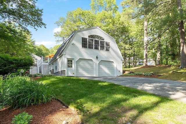 2 Pomfret Rd, Chelmsford, MA 01824 - view of home's exterior with a gambrel roof, an attached garage, a lawn, and driveway