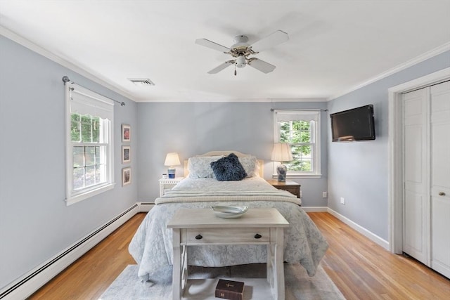 2 Pomfret Rd, Chelmsford, MA 01824 - bedroom with baseboard heating, ornamental molding, light wood-style floors, baseboards, and a ceiling fan