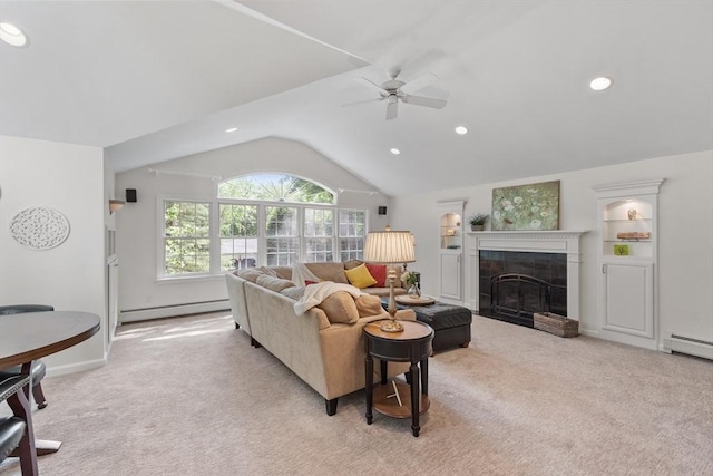 2 Pomfret Rd, Chelmsford, MA 01824 - living area with a baseboard radiator, ceiling fan, light colored carpet, a tile fireplace, and vaulted ceiling