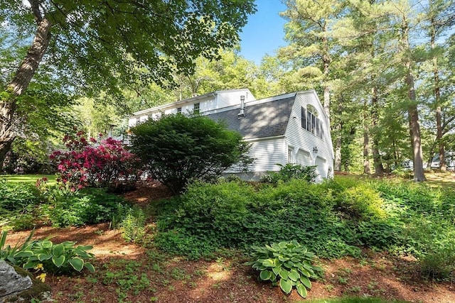 2 Pomfret Rd, Chelmsford, MA 01824 - view of side of home with a gambrel roof, a garage, and a shingled roof