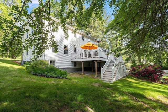 2 Pomfret Rd, Chelmsford, MA 01824 - rear view of property featuring a wooden deck, stairs, and a yard