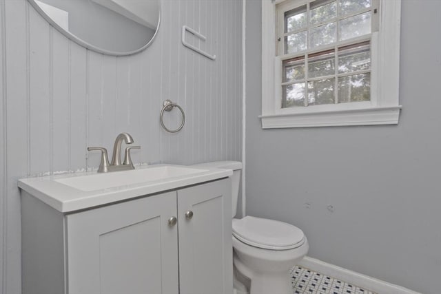 bathroom featuring vanity and toilet