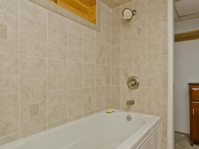 bathroom featuring vanity and tiled shower / bath combo