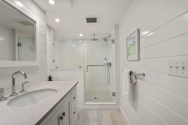 21 Glenwood St, Yarmouth, MA 02673 - bathroom with a stall shower, vanity, and recessed lighting