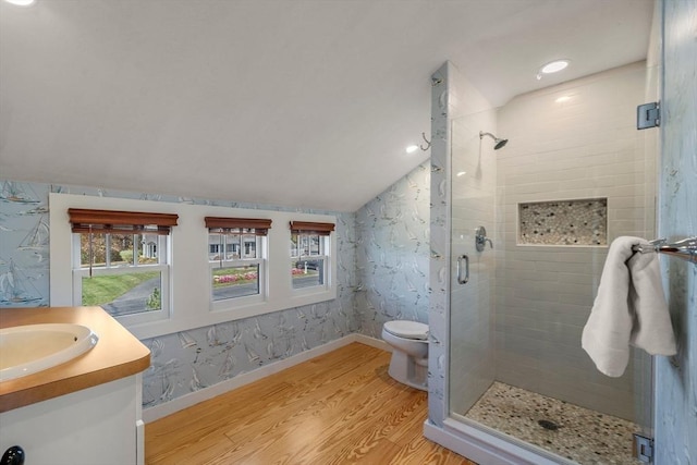 21 Glenwood St, Yarmouth, MA 02673 - full bath with a stall shower, plenty of natural light, wood finished floors, vanity, and vaulted ceiling