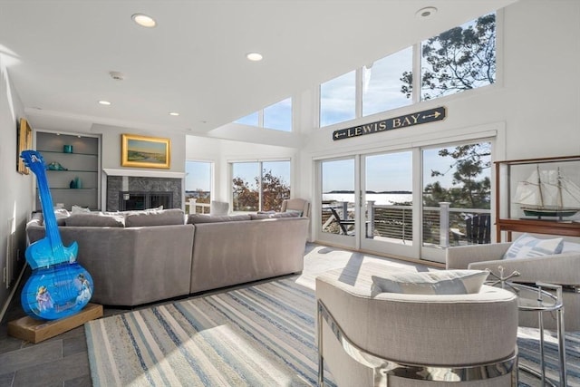 21 Glenwood St, Yarmouth, MA 02673 - living area featuring a premium fireplace, recessed lighting, and a high ceiling