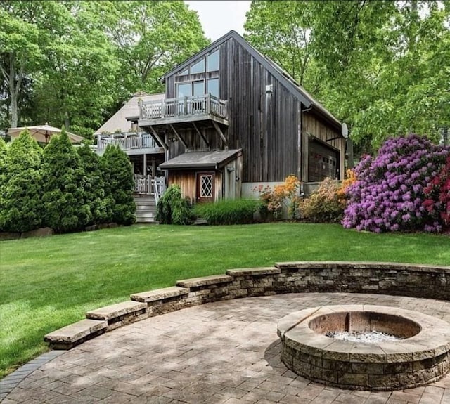 1820 Bay St, Taunton, MA 02780 - back of house featuring a fire pit, a balcony, a yard, and a patio