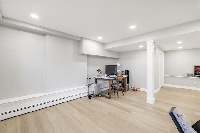 office space featuring a baseboard heating unit, recessed lighting, baseboards, and wood finished floors