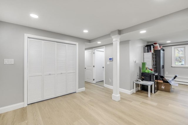 basement with light wood-style floors, baseboards, and recessed lighting