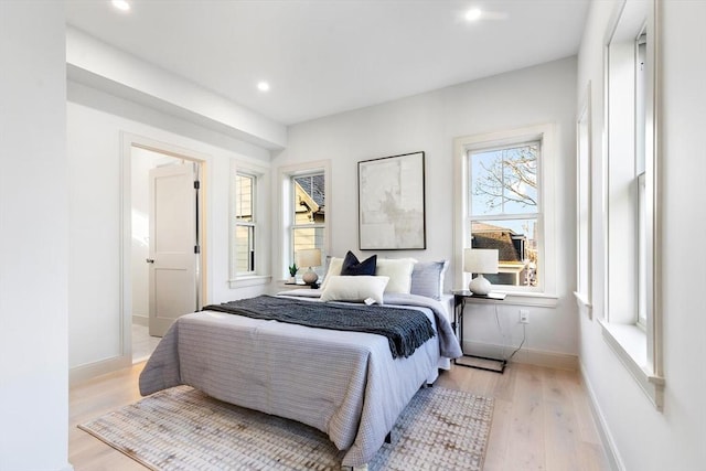 bedroom with light hardwood / wood-style flooring