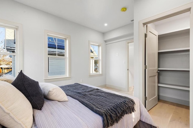 bedroom with light hardwood / wood-style flooring