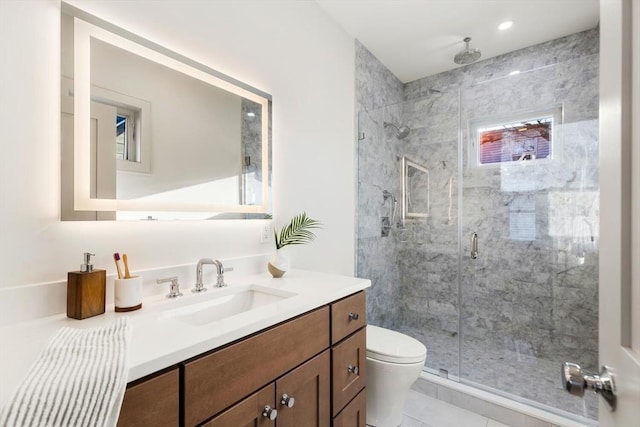 bathroom featuring tile patterned floors, vanity, an enclosed shower, and toilet