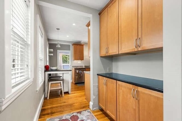 29 Daniels St Unit 29, Arlington, MA 02476 - kitchen with light wood-style floors, dark countertops, recessed lighting, and hanging light fixtures