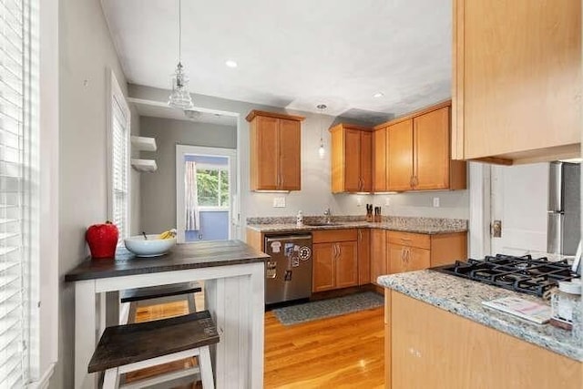 29 Daniels St Unit 29, Arlington, MA 02476 - kitchen with stainless steel dishwasher, light wood-type flooring, pendant lighting, recessed lighting, and light stone counters