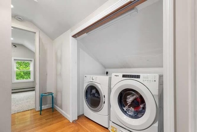 29 Daniels St Unit 29, Arlington, MA 02476 - laundry area featuring a baseboard heating unit, washing machine and clothes dryer, and light wood-style floors